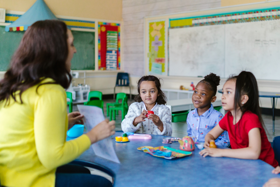 Teacher and young students